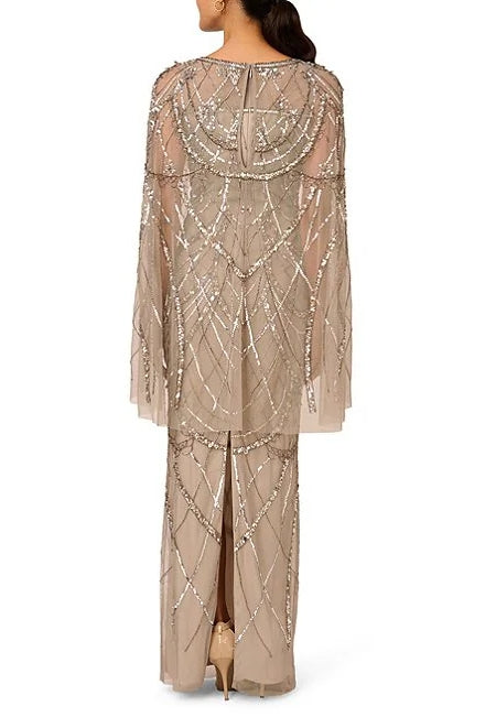 Adrianna Papell Sweetheart Boat Neck Cape Sleeves Beaded Mesh Illusion Trim Flutter Hemline Sheath Floor-Length Silhouette Dress | Available at Curated Brands in Los Angeles Adrianna Papell Sweetheart Boat Neck Cape Sleeves Beaded Mesh Illusion Trim Flutter Hemline Sheath Floor-Length Silhouette Dress | Available at Curated Brands in Los Angeles