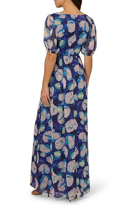 Adrianna Papell Floral Print Pleating Surplice V-Neckline Short Sleeves Elastic Cuffs Ruched Waist Seam Front Slit Chiffon Maxi Dress | Available at Curated Brands in Los Angeles Adrianna Papell Floral Print Pleating Surplice V-Neckline Short Sleeves Elastic Cuffs Ruched Waist Seam Front Slit Chiffon Maxi Dress | Available at Curated Brands in Los Angeles