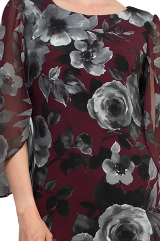 Vestido camisero con cuello barco, abertura en la parte delantera, mangas ¾ de gasa y estampado floral de Connected Apparel